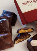 Load image into Gallery viewer, Close up image of chocolate pieces with a 6 piece box
