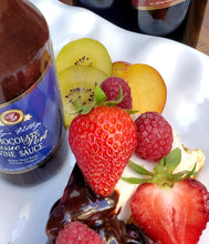 Load image into Gallery viewer, display image of fruits on cheesecake with port sauce